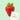 A single ripe red strawberry with green leaves sits on a pale mint-green background next to a small torn paper note that reads 'Ingredients: Strawberry'.
